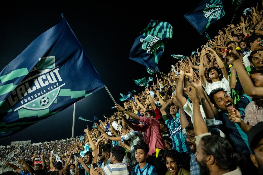 A wave of excitement sweeps through the crowd as Calicut FC scores.