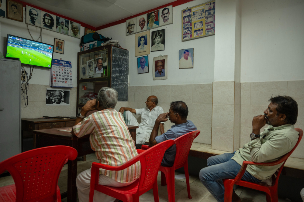 Fans watching a football match at the local CPI(M) party office in Kuttichira. Photo by Joseph Rahul.